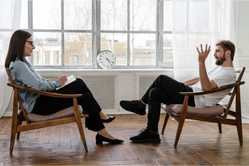 Man and woman sitting and talking